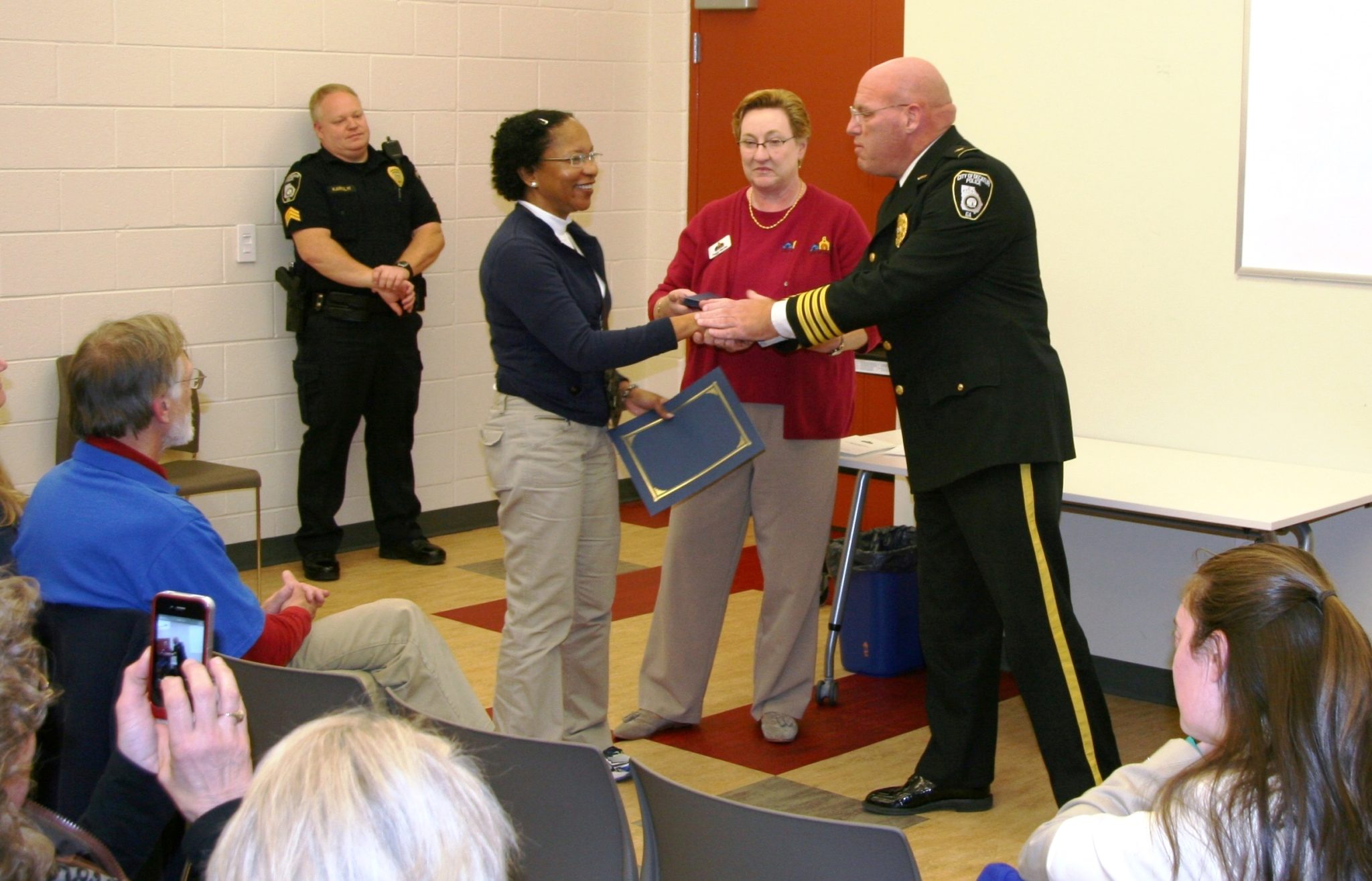 Police Chief Mike Booker, congratulating a Decatur Citizens Police Academy graduate. Photo courtesy of the Decatur Police Department.