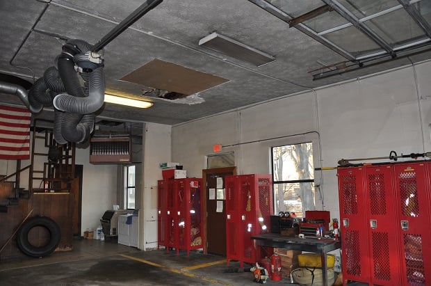 Holes are visible in the ceiling of the garage at the fire station on Clarendon Ave. in Avondale Estates. Photo by: Dan Whisenhunt