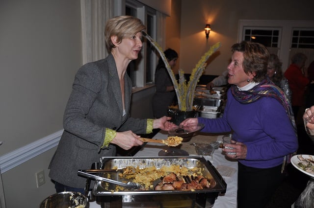 Luellen Marshall, owner of The Bishop restaurant, serves up ham steak and Gouda grits during the Taste of Avondale event on Feb. 15, 2014. File photo by: Dan Whisenhunt