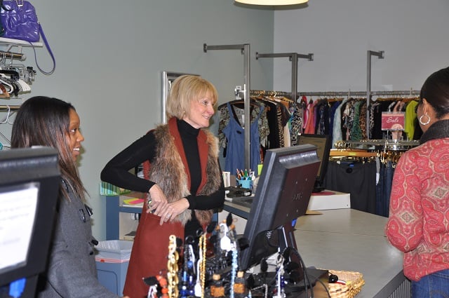 Bonnie Kallenberg, center, talks to customers at Finders Keepers Fashions in Avondale Estates. Photo by: Dan Whisenhunt
