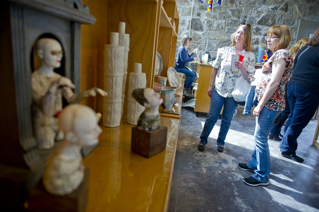 Photo: Jonathan Phillips Gail MacLeod (left) and Rena Alford look at some of the pottery at MudFire Pottery Gallery during the Rail Arts District's Art Cruise on Saturday, March 15, 2014.