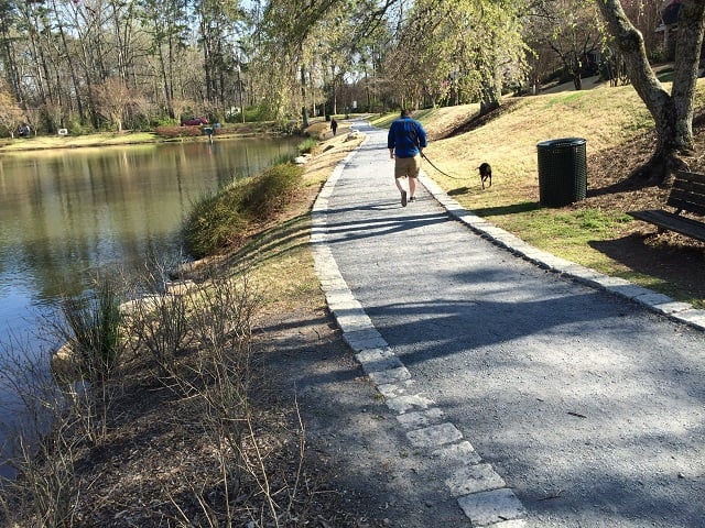 A man and his dog enjoy Lake Avondale. Photo from the city of Avondale Estates website