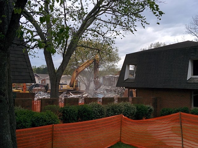 A crane demolishes buildings at the Decatur Housing Authority. Photo by: Dan Whisenhunt