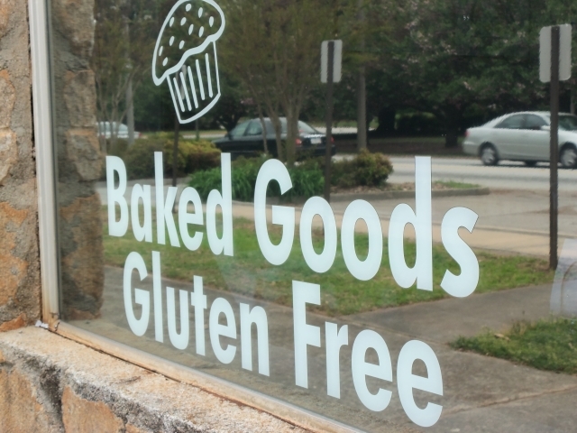 The storefront of Good Karma Coffee House in Avondale Estates advertises its gluten-free baked goods. Photo by: Dena Mellick