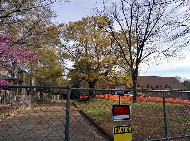 A fence is up around the church at 109 Hibernia Avenue. Soon the church will come down and will be replaced by 20 townhomes. Photo by: Dan Whisenhunt