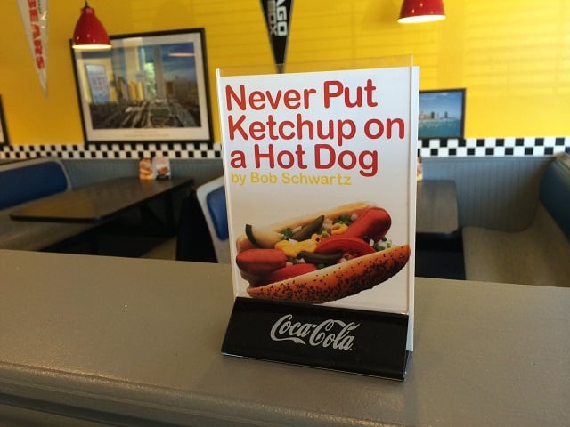 Advertising placard for a book about Chicago hot dogs. Photo by: Ralph Ellis