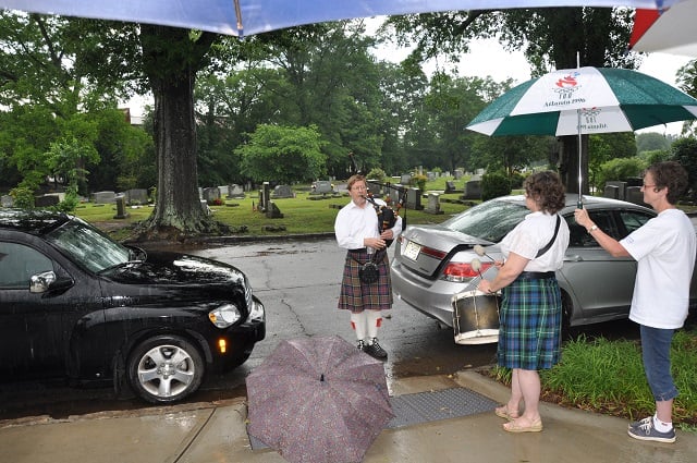 Another bystander played  "Amazing Grace" on the bagpipes during the Memorial Day ceremony at the Decatur Cemetery. Photo by Dan Whisenhunt