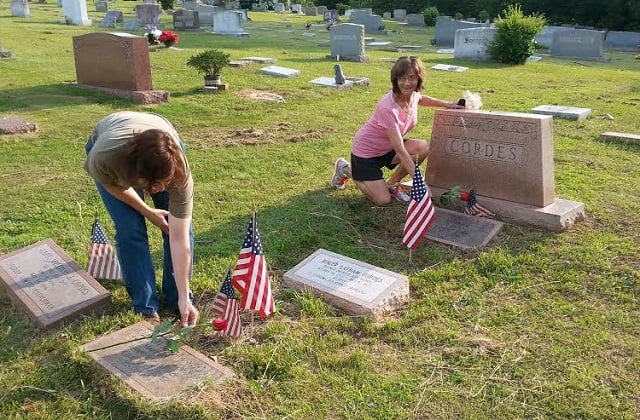 Residents mark Memorial Day in Decatur by placing flags on the graves of veterans at the Decatur Cemetery. Photo by Chris Billingsley. 