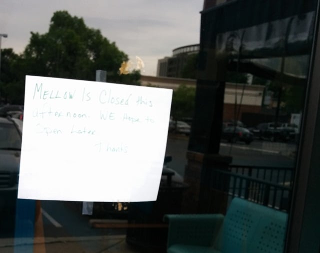 Sign on the door of the Mellow Mushroom, May 9.  Photo by Dan Whisenhunt