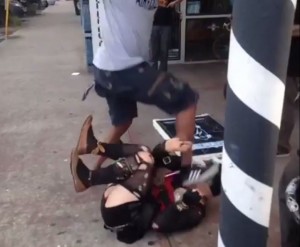 A screenshot from a video depicting an attack on a transgender woman in Atlanta's Little Five Points community. 