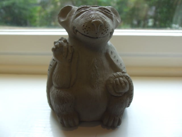 This meditating rat statue may be amusing, but real rats in your home are no laughing matter. Photo by Dena Mellick