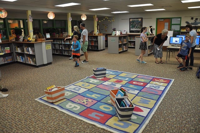 Students and parents check out the library at Westchester Elementary on July 31. Photo by Dan Whisenhunt