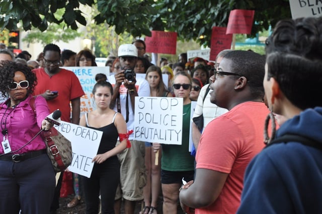A speaker addresses a crowd gathered at the Decatur, Ga. courthouse on Aug. 14, 2014. Photo by Dan Whisenhunt
