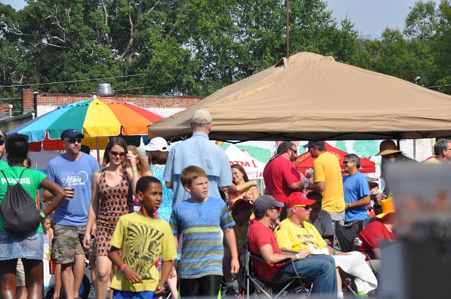 People milling around the festival on Saturday. Photo by Dan Whisenhunt