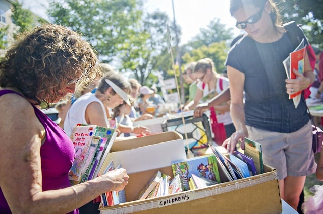 Photo: Jonathan Phillips  Lisa Goldman (left) and Mary Lynn Gaines (right) look through boxes of children's books during the AJC Decatur Book Festival on Saturday, August 30, 2014. The ninth annual event saw tens of thousands of people come out to the downtown Decatur area to meet with world-class authors, illustrators, editors, publishers, booksellers, and artists for a weekend filled with literature, music, food, art, and fun.