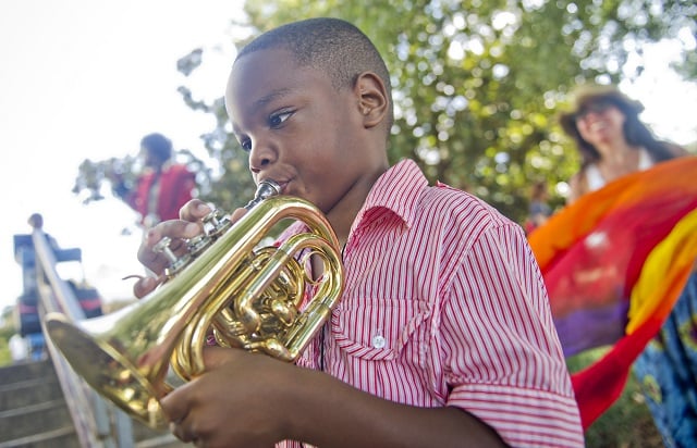 Photo: Jonathan Phillips  August Murray plays a trumpet during the AJC Decatur Book Festival on Saturday, August 30, 2014. The ninth annual event saw tens of thousands of people come out to the downtown Decatur area to meet with world-class authors, illustrators, editors, publishers, booksellers, and artists for a weekend filled with literature, music, food, art, and fun.