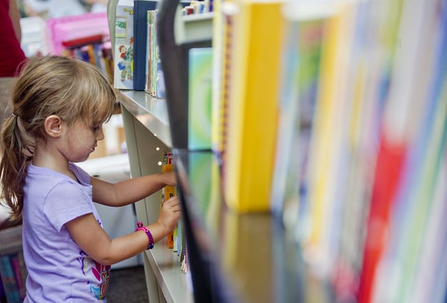 Photo: Jonathan Phillips  Sadie Walker thumbs through a section of children's books during the AJC Decatur Book Festival on Saturday, August 30, 2014.