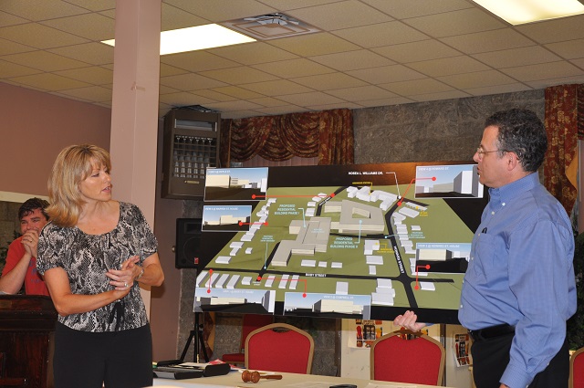 Euramex VP Jetha Wagner, left, and attorney Steve Rothman, right, discuss a proposed apartment project in Kirkwood during the Aug. 10 Kirkwood Neighbors' Organization meeting. Photo by Dan Whisenhunt
