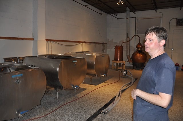 Michael Anderson, co-owner of Independent Distilling in Decatur, shows off the company's brewing process. Photo by Dan Whisenhunt