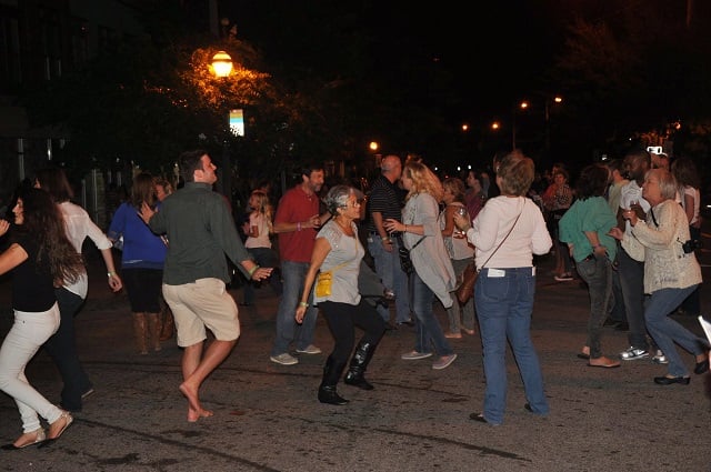 Crowd dancing in the middle of Hosea Williams during the Kirkwood Wine Stroll