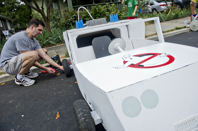 Photo: Jonathan Phillips Greg Waldrop makes last minute adjustments to the braking system for the Ecto 1 from the movie Ghostbusters before the start of the 4th annual Madison Ave. Soap Box Derby in Decatur on Saturday, September 27, 2014.