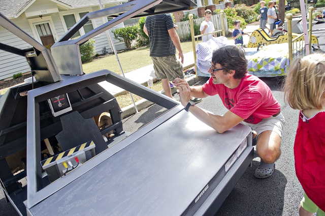 Photo: Jonathan Phillips Brady Lewis takes a photo of the delorean from the movie Back to the Future before the start of the 4th annual Madison Ave. Soap Box Derby in Decatur on Saturday, September 27, 2014.