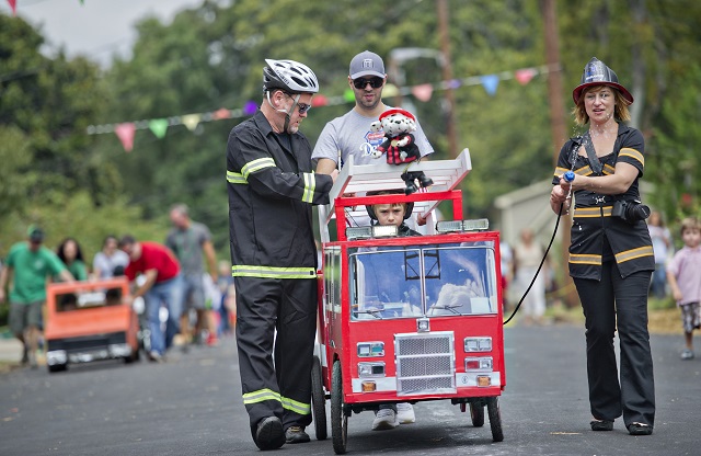 Photo: Jonathan Phillips Eric Blue (left) and his wife Erin escort their son Dylan to the starting line during the 4th annual Madison Ave. Soap Box Derby in Decatur on Saturday, September 27, 2014.