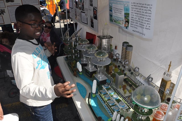 Jovian Lawrence shows off the city of tomorrow at the 2014 Maker Faire. Photo by Dan Whisenhunt