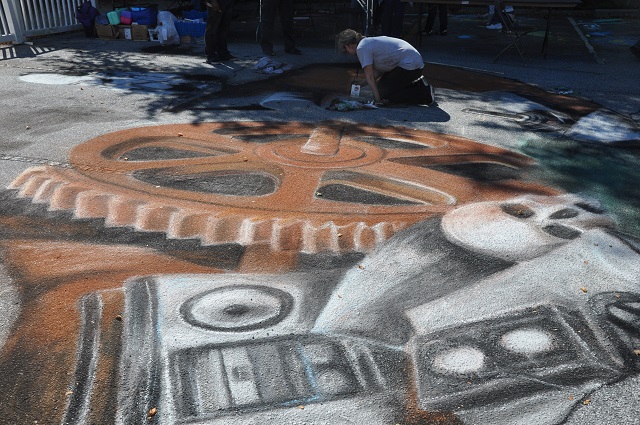 Artist making good use of the parking lot during Maker Faire Atlanta. Photo by Dan Whisenhunt
