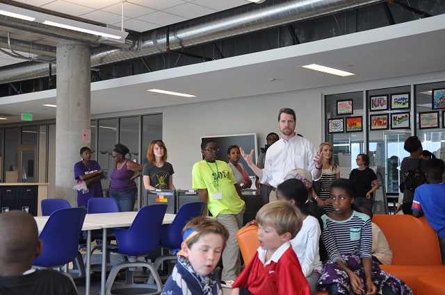Senior Academy Principal Peter McKnight explains some of the ideas behind the layout of a shared space at the Charlie Yates Campus. Photo by Dan Whisenhunt