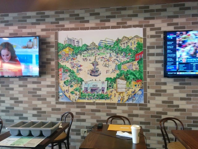 A painting hanging on the wall of the Fresh To Order restaurant in Decatur, Ga. 