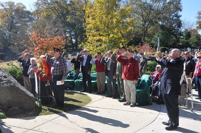 Michael Schmidt plays taps during a Veterans Day ceremony on Nov. 11. Photo by Dan Whisenhunt