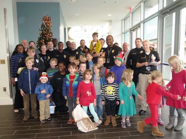 A group of Decatur families brought Christmas cheer to the Police Department on Dec. 23. Photo provided by the Decatur Police Department. 