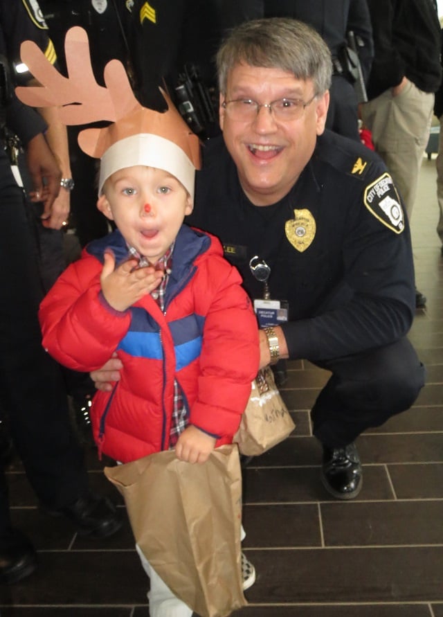Deputy Chief Keith Lee poses for a picture with a boy dressed like a reindeer. Photo provided by the Decatur Police Department