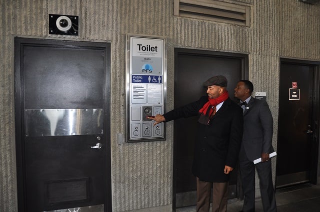 MARTA CEO Keith Parker shows off a state of the art bathroom system at the Lindbergh Station. Photo by Dan Whisenhunt