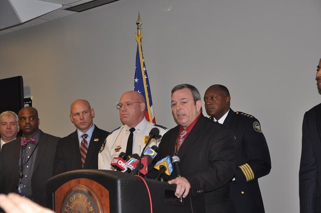 Decatur Police Chief Mike Booker, left, stands next  to Atlanta Police Homicide Commander Capt. Paul Guerrucci, behind the podium, during a Dec. 16 press conference. Photo by Dan Whisenhunt