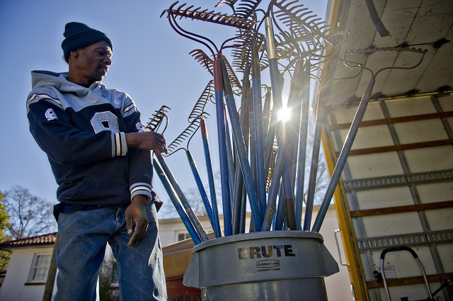 Ronnie Williams pulls out buckets of tools that will be used to make repairs during the Decatur Martin Luther King Jr. Service Project weekend on Sunday, January 18, 2015. Photo by Jonathan Phillips