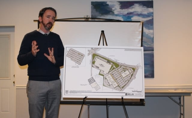 Greg Catoe, Project Manager of the Suburban Plaza redevelopment for Selig Enterprises, discussed timelines at the DHNA meeting for the new businesses coming to the shopping center. Photo by Dena Mellick