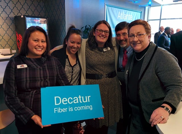 Decatur City officials celebrate the news about Google Fiber. Lena Stevens is pictured in the center of this photo. File Photo by Dan Whisenhunt