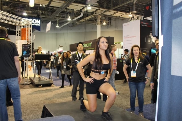 A Wahoo Fitness athlete at the company's CES booth demonstrates how the TICKR X can count reps. Photo by Dena Mellick