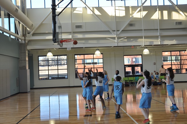 Two girls' teams - Team Bivens and Team Goodlow - square off in the first game held at the Ebster Recreation Center on Feb. 11, 2015. Photo by Dan Whisenhunt