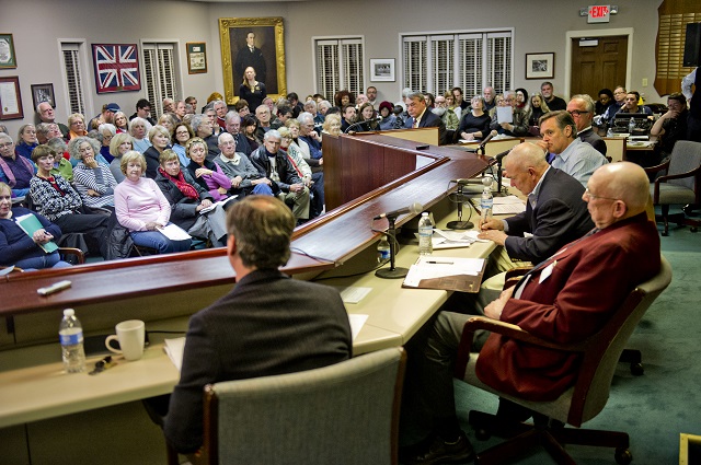 A packed room listens as mayoral candidates answer questions during the Avondale Estates mayoral candidate forum at city hall on Thursday, February 19, 2015. Photo by Jonathan Phillips