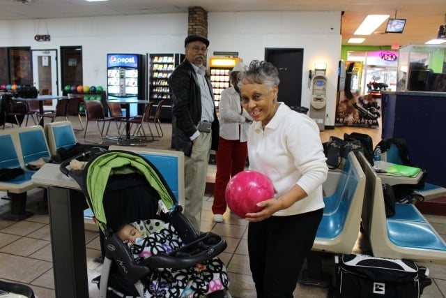 Marie Chaney brings her grandchild along with her occasionally when she bowls. She's been coming to Suburban Lanes for 15 years. Photo by Dena Mellick