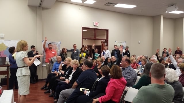 State Senator Elena Parent takes a poll of the crowd at a cityhood and annexation town hall. Photo by Dena Mellick
