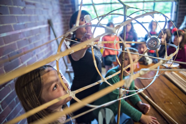 Photo: Jonathan Phillips Skylar Marks (left) looks at a fish shaped bamboo lantern during a workshop at Color Wheel Studio in Decatur on Friday, April 24, 2015. 12 workshops will be held before the Decatur Lantern Parade on May 15.