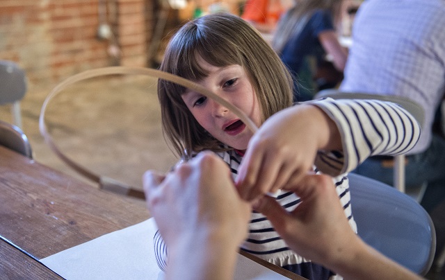 Photo: Jonathan Phillips Lily Zeigler forms bamboo as she makes a lantern during a workshop at Color Wheel Studio in Decatur on Friday, April 24, 2015. 12 workshops will be held before the Decatur Lantern Parade on May 15.