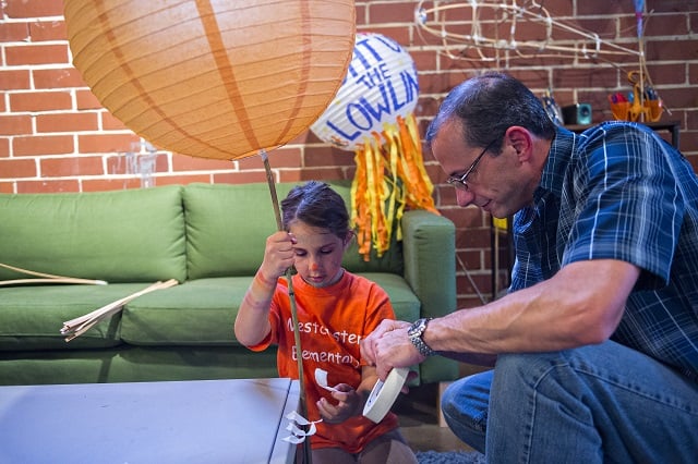 Photo: Jonathan Phillips Silvia Malerba (left) and her father Rich decorate their lantern during a workshop at Color Wheel Studio in Decatur on Friday, April 24, 2015. 12 workshops will be held before the Decatur Lantern Parade on May 15.