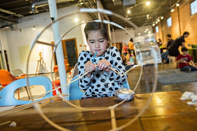 Photo: Jonathan Phillips Lana Baker creates a bamboo lantern during a workshop at Color Wheel Studio in Decatur on Friday, April 24, 2015. 12 workshops will be held before the Decatur Lantern Parade on May 15.