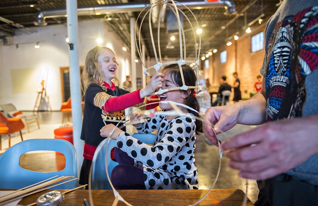 Photo: Jonathan Phillips Jude Harper Barcik (left) places her lantern over Lana Baker's head during a workshop at Color Wheel Studio in Decatur on Friday, April 24, 2015. 12 workshops will be held before the Decatur Lantern Parade on May 15.