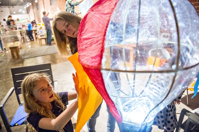 Photo: Jonathan Phillips Lily Mae Barcik (left) and her mother Tiffany create a balloon shaped lantern during a workshop at Color Wheel Studio in Decatur on Friday, April 24, 2015. 12 workshops will be held before the Decatur Lantern Parade on May 15.